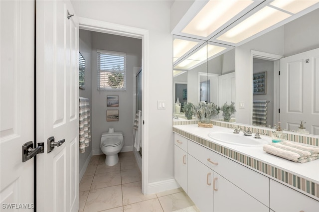 bathroom with vanity, toilet, walk in shower, and tile patterned flooring