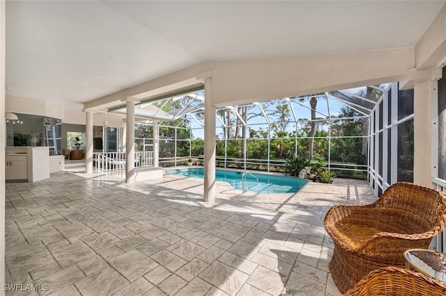 view of pool featuring a lanai and a patio area