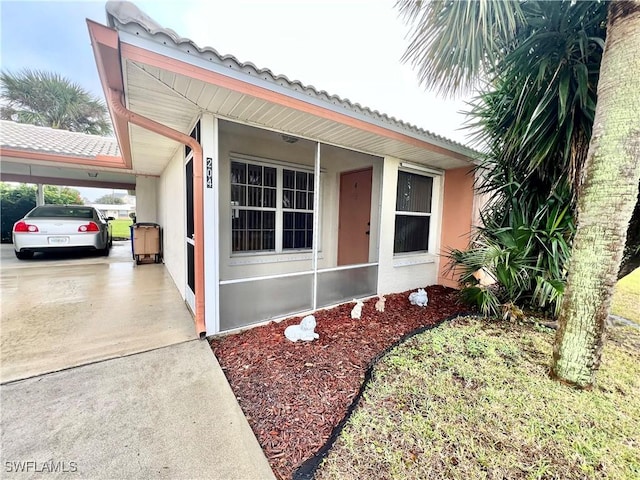 view of front of home featuring a carport