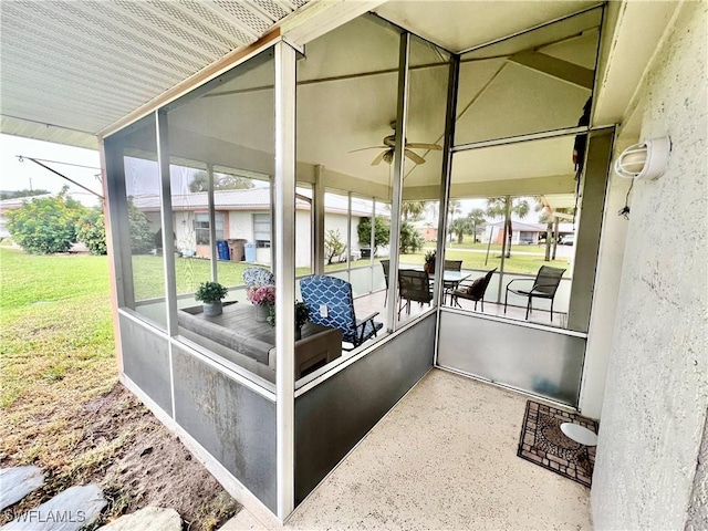 sunroom / solarium with ceiling fan