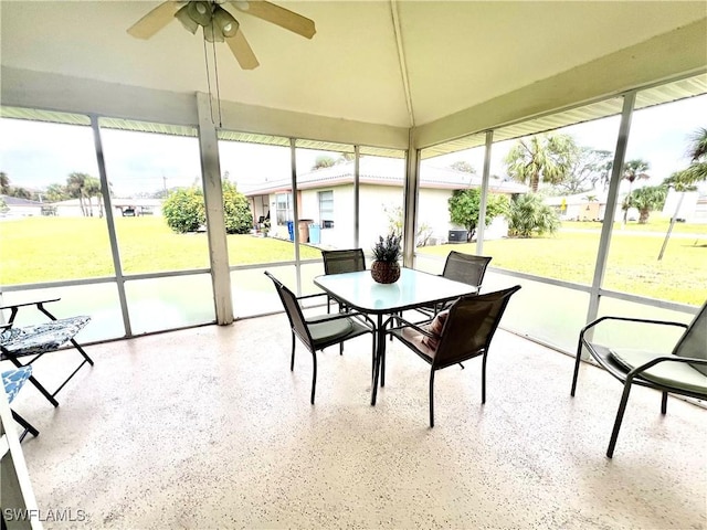 sunroom featuring ceiling fan and a healthy amount of sunlight