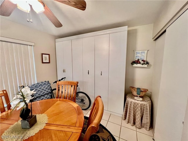 dining space with ceiling fan and light tile patterned floors