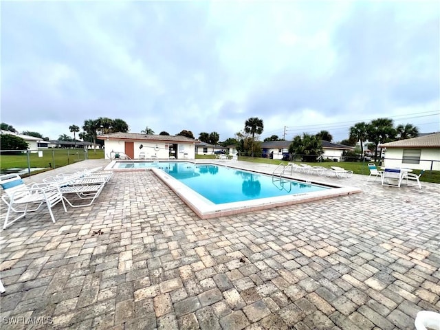 view of swimming pool with a patio