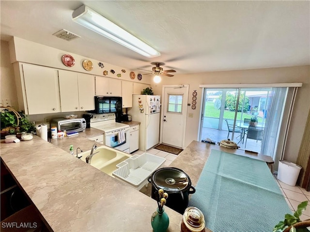 kitchen featuring ceiling fan, white cabinetry, white appliances, and light tile patterned floors