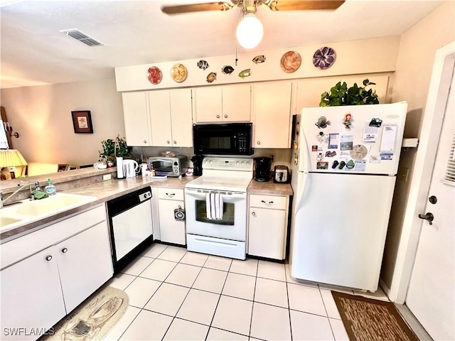 kitchen with ceiling fan, sink, white cabinetry, light tile patterned floors, and white appliances