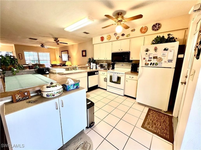 kitchen featuring white appliances, white cabinets, sink, kitchen peninsula, and light tile patterned floors