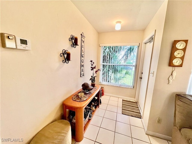 entryway featuring light tile patterned flooring