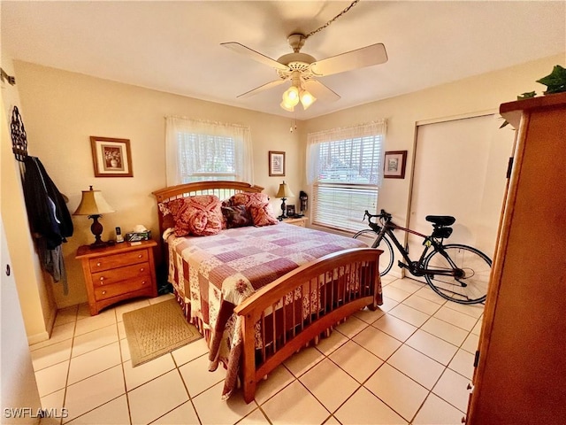 tiled bedroom with ceiling fan