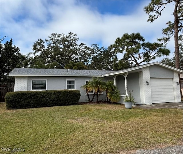 single story home with a garage and a front lawn