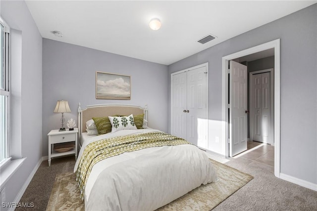 bedroom featuring a closet and carpet flooring