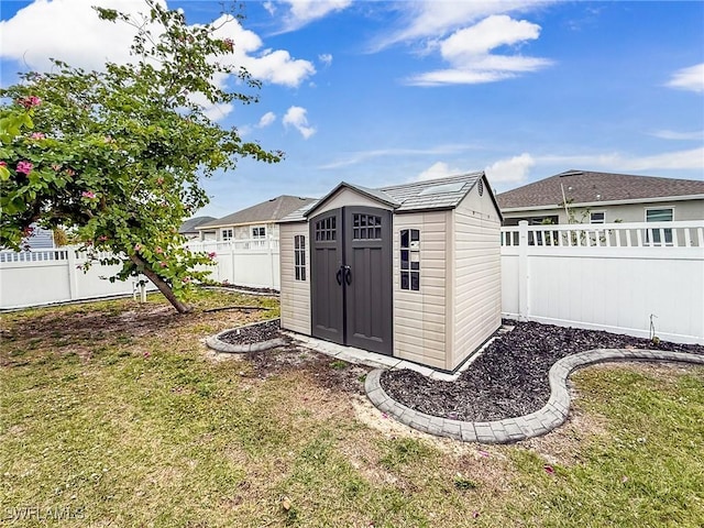 view of shed featuring a fenced backyard