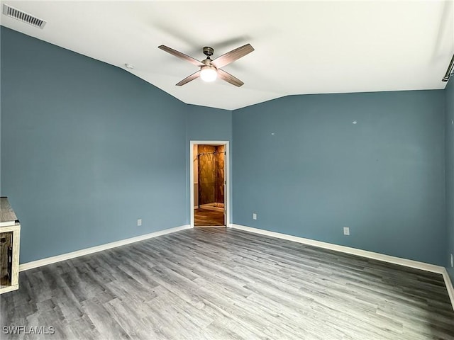 interior space featuring wood-type flooring, vaulted ceiling, and ceiling fan