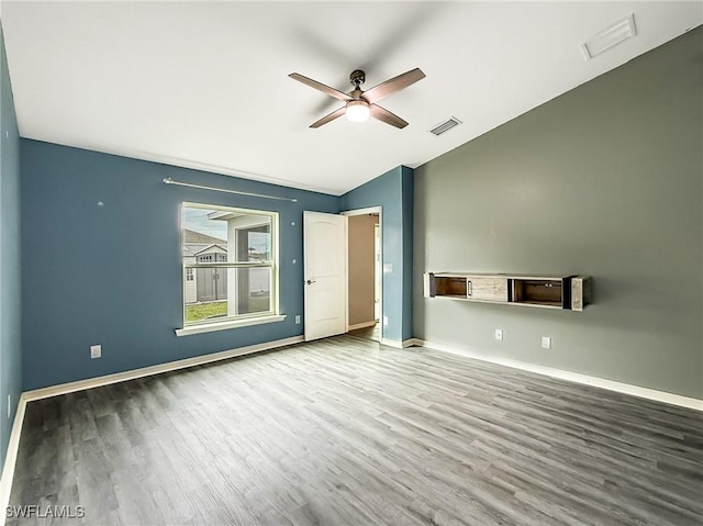 interior space featuring vaulted ceiling, hardwood / wood-style floors, and ceiling fan