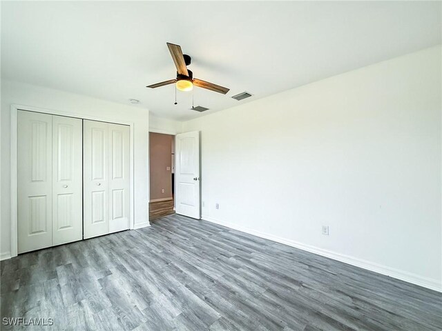 unfurnished bedroom with a closet, ceiling fan, and light wood-type flooring