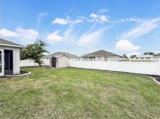 view of yard with a storage unit