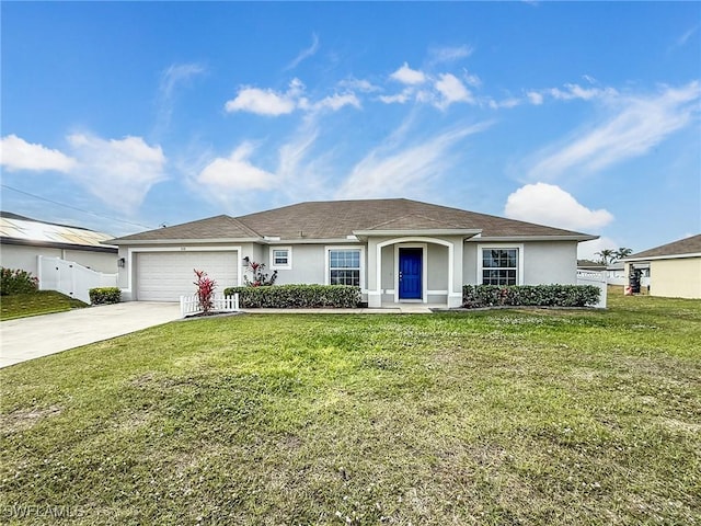 ranch-style house with driveway, a front yard, a garage, and stucco siding