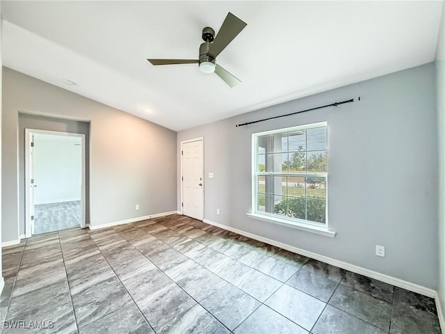 empty room with lofted ceiling and ceiling fan