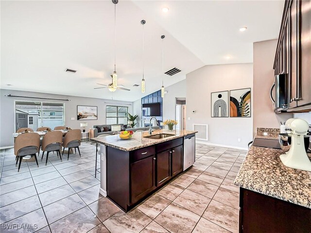 kitchen featuring dark brown cabinets, appliances with stainless steel finishes, a sink, and visible vents