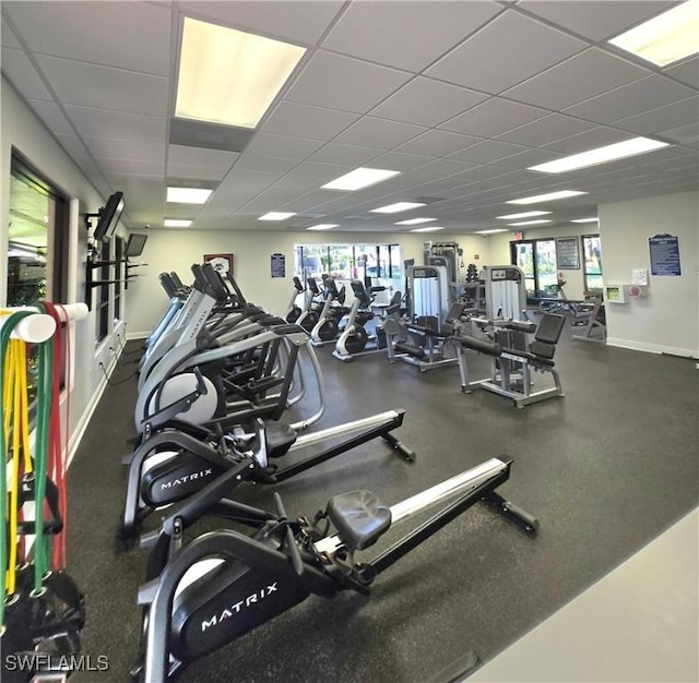 workout area with a paneled ceiling