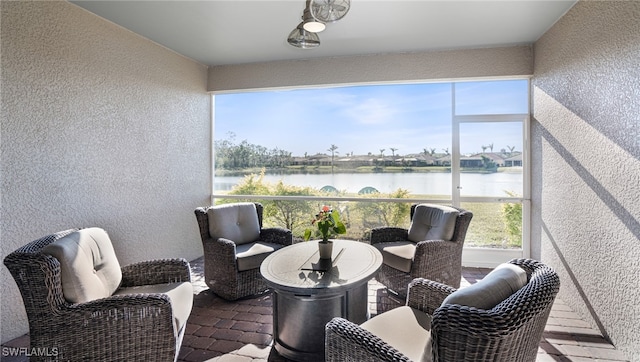 sunroom with a water view