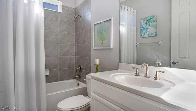 full bathroom with vanity, shower / tub combo, and toilet