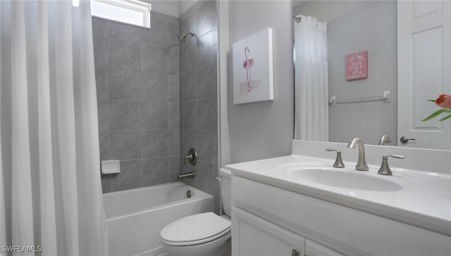 full bathroom with shower / tub combo, vanity, and toilet