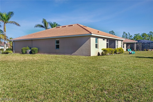 view of side of property with a yard