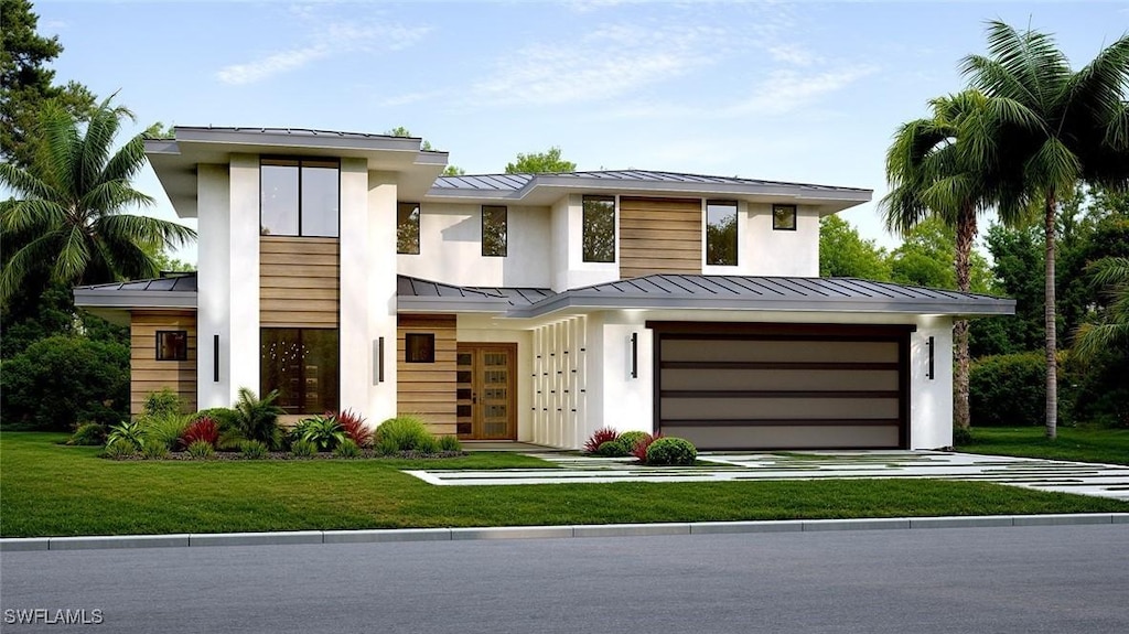 view of front facade with a garage and a front lawn