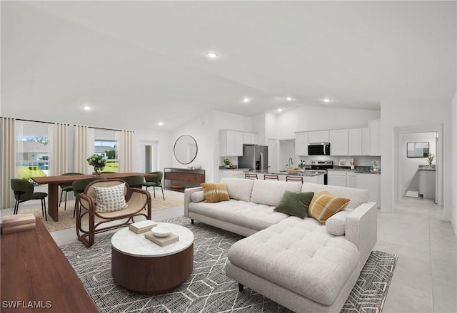 living room with high vaulted ceiling