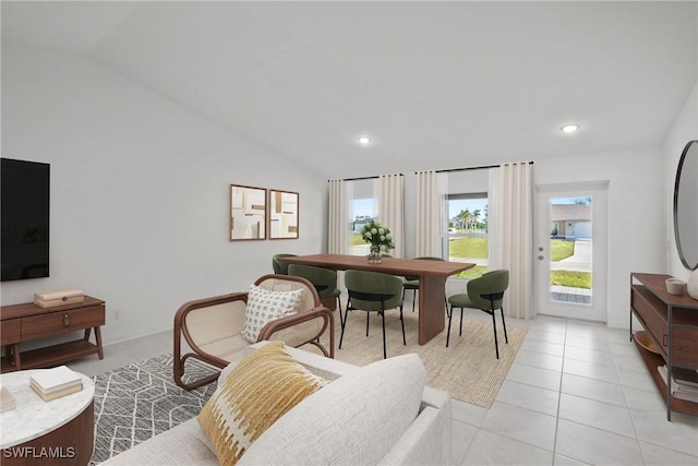 tiled living room featuring vaulted ceiling