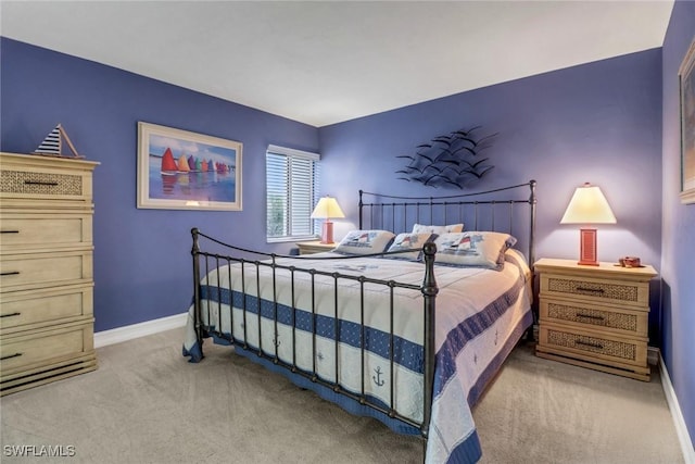 bedroom with light colored carpet