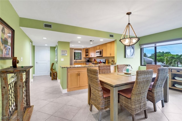 dining area with recessed lighting, light tile patterned floors, baseboards, and visible vents