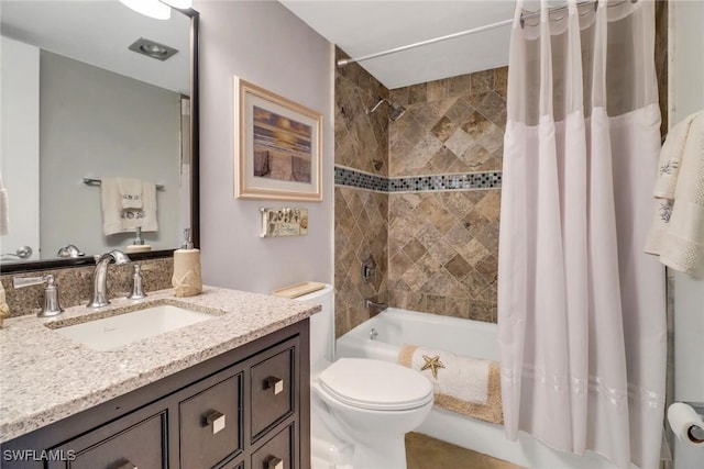 full bathroom with vanity, toilet, and shower / tub combo