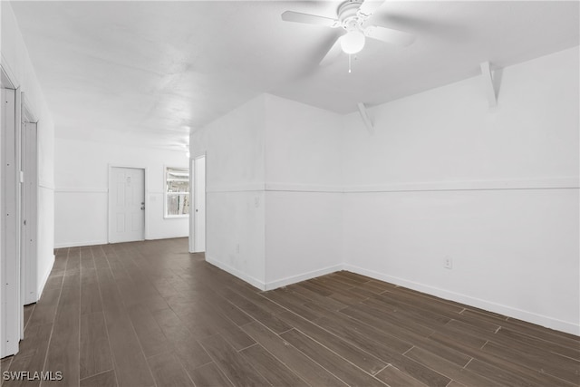 unfurnished room featuring ceiling fan and dark hardwood / wood-style floors