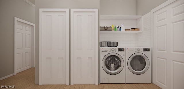 washroom featuring light wood-type flooring and washing machine and dryer