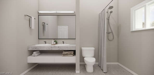 bathroom featuring toilet, a shower, and vanity