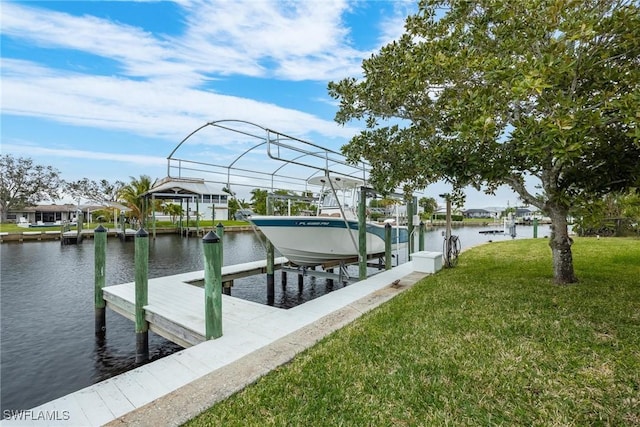 dock area with a water view and a yard