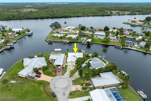 birds eye view of property with a water view