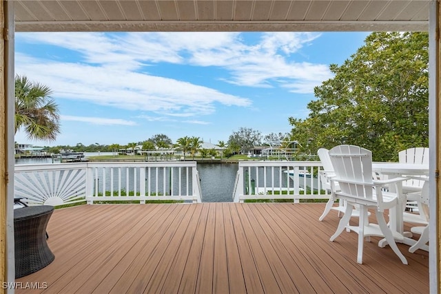 wooden deck featuring a water view