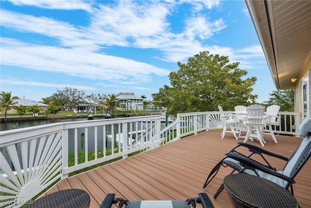 wooden terrace with a water view