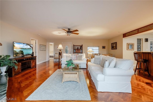 living room with parquet floors and ceiling fan