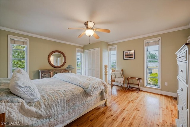 bedroom featuring ornamental molding, ceiling fan, and light wood-type flooring