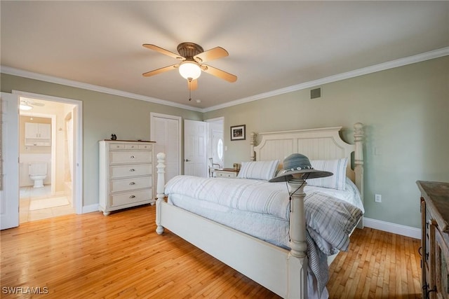 bedroom featuring connected bathroom, crown molding, light hardwood / wood-style flooring, and ceiling fan