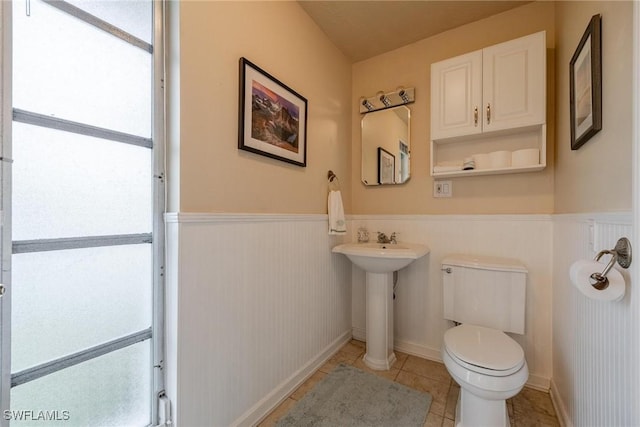 bathroom featuring tile patterned flooring and toilet