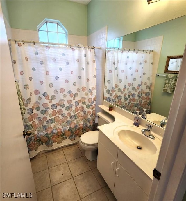 full bathroom with shower / bath combination with curtain, vanity, toilet, and tile patterned floors