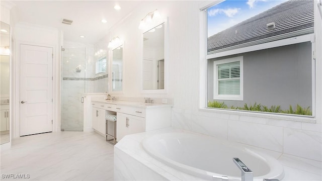 bathroom with crown molding, vanity, and independent shower and bath