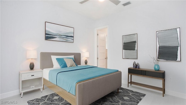 bedroom featuring ceiling fan and ensuite bath