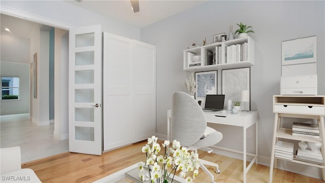 office space with hardwood / wood-style flooring and ceiling fan