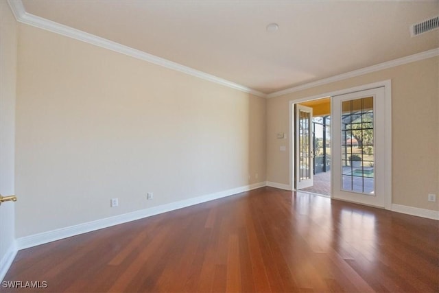 unfurnished room with ornamental molding and dark hardwood / wood-style floors