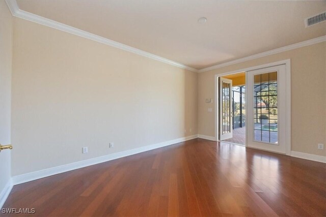28830 Kiranicola Ct, Bonita Springs, FL 34135 - spare room featuring dark wood-type flooring, ornamental molding, and baseboards